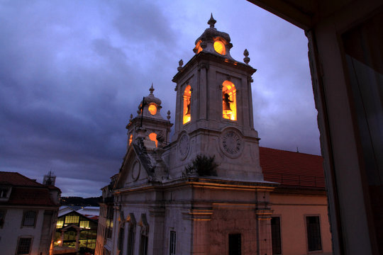 Church with glowing bell tower at night