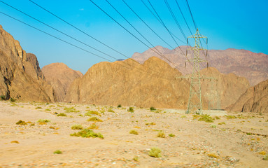 Power lines passing through the mountains of Egypt