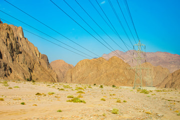 Power lines passing through the mountains of Egypt