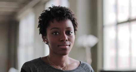 Portrait of young african american female in loft apartment