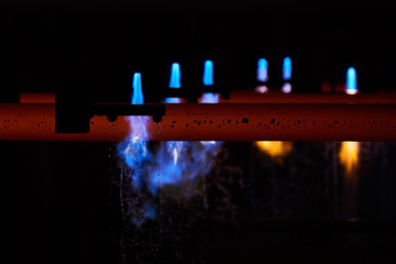 Iron factory with hot candent block of iron or steel or zinc in process of production or cooling