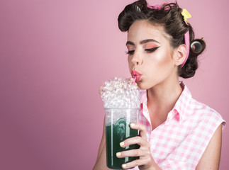 pretty girl in vintage style. pin up woman with trendy makeup. pinup girl with fashion hair. perfect housewife. retro woman drink summer cocktail, copy space. Young and free