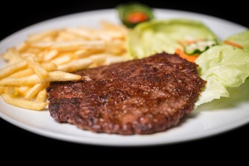 hamburger with french fries isolated on plate.