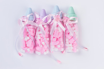 Baby bottles with medicine pills.