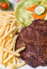 hamburger with french fries isolated on plate.