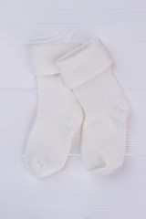 Pair of white warm wool toddler socks.