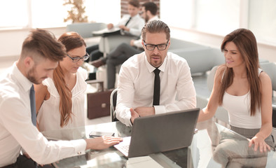 group of business people sitting at the Desk