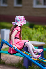 little girl playing on the Playground