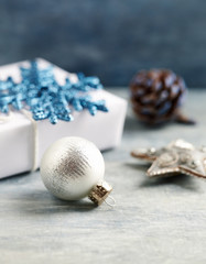 Christmas decoration and Christmas present. Christmas time. Close up. Copy space. Wooden background. 