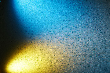 Bright light yellow and blue on a textural background