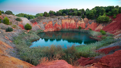 Fototapeta na wymiar Otranto, Puglia, Italy. View of the lake in a old bauxite's quarry at sunset