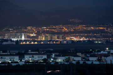 city ​​of Granada at nightfall with Sierra Nevada in the background
