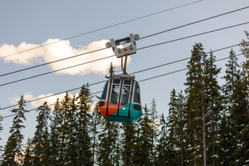 Cable car gondolas travelling up and down Sulphur Mountain in Banff © yooranpark