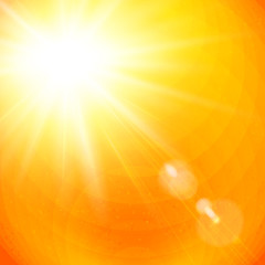 Obraz premium Żywy pomarańczowy sunburst z rozbłyskiem słońca