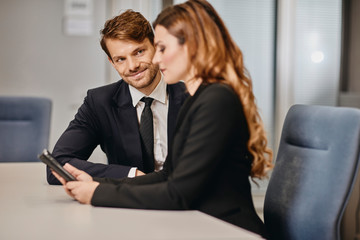 A couple of bussinessmen and bussines woman discussing an important topic