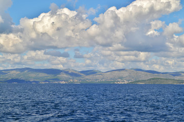 Adriatic sea in Croatia, land in the distance. The blue sky and white clouds.