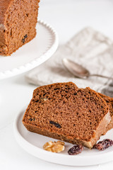 Homemade gingerbread cake on white plate. Honey cake.