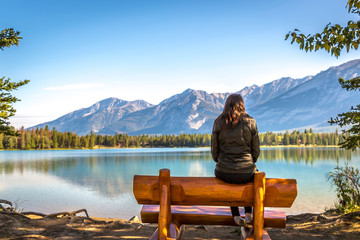 Young woman in front of an amazing scenario in Jasper National Park in Canada