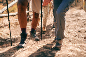 Close up of legs walking in nature. Hiking concept.