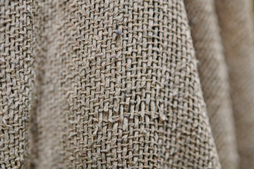 The texture of an old grey sackcloth, bachground, close-up