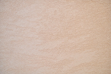 The texture of plastered beige wall, background