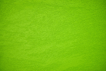Naklejka na ściany i meble The texture of plastered apple or lime green wall, background