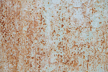 The texture of an old colored wall with small points of rust, background