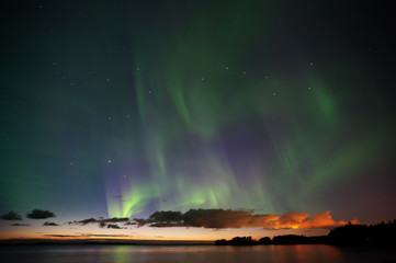 Aurora Borealis, Big Dipper and Bootes in the darkening evening sky.