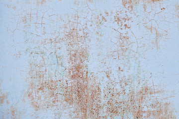 The texture of an old colored wall with small points of rust, background