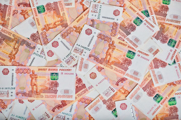 A lot of russian money banknotes of roubles, background