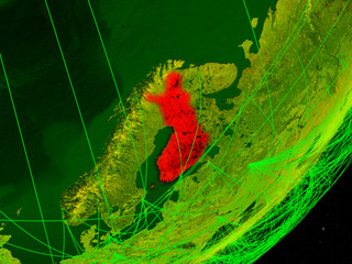 Finland on green model of planet Earth with network at night. Concept of digital technology, communication and travel.