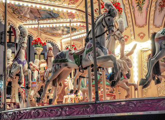 Christmas holidays, vintage carousel with horses in Como,Italy