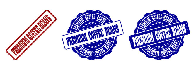 PREMIUM COFFEE BEANS scratched stamp seals in red and blue colors. Vector PREMIUM COFFEE BEANS labels with scratced texture. Graphic elements are rounded rectangles, rosettes, circles and text labels.