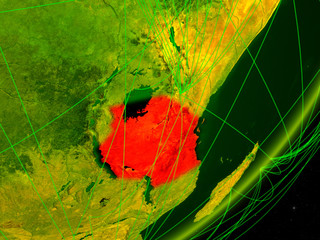 Tanzania on green model of planet Earth with network at night. Concept of digital technology, communication and travel.