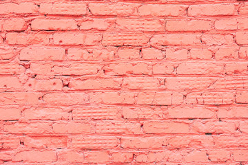 Painted vintage grunge brick wall texture, coral color, trendy urban background. Horizontal texture. For banner design