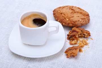 Perfect morning breakfast with Classic espresso in white cup, cake and chocolate on white background.