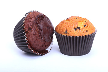 Assorted with Delicious homemade muffin, cupcake with raisins, nuts and chocolate isolated on white background.