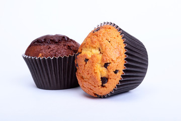 Assorted with Delicious homemade muffin, cupcake with raisins, nuts and chocolate isolated on white background.