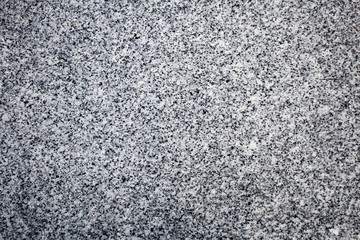 Black and white granite stone surface, perfect for use in background or texture.
