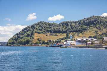 Fototapeta na wymiar Tenaun skyline with Church on background - Tenaun, Chiloe Island, Chile