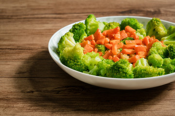 Green broccoli with wooden background