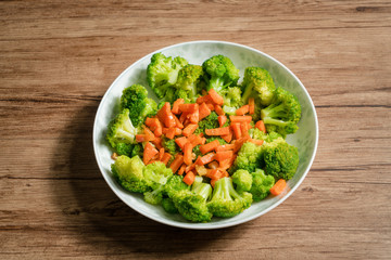 Green broccoli with wooden background