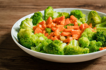 Green broccoli with wooden background