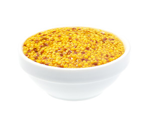 Mustard sauce, wholegrain mustard in ceramic bowl isolated on white background