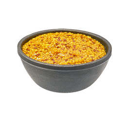 Mustard sauce, wholegrain mustard in  black bowl isolated on white background