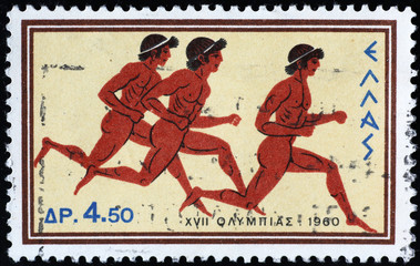 Ancient greek athletes running on postage stamp 