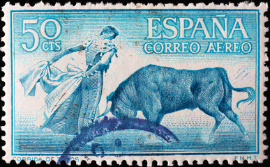 Bullfighter in action on old spanish stamp