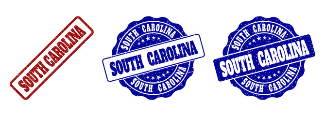 SOUTH CAROLINA scratched stamp seals in red and blue colors. Vector SOUTH CAROLINA labels with draft surface. Graphic elements are rounded rectangles, rosettes, circles and text labels.