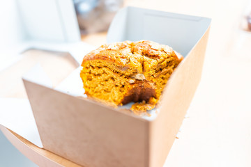 Cardboard box from store storebought bundt cake carrot or pumpkin halloween autumn christmas season dessert showing detail and texture
