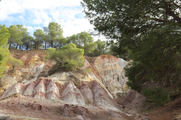 Typical Aragonese geological formations with pyramids of mud of different colors, from grey to...